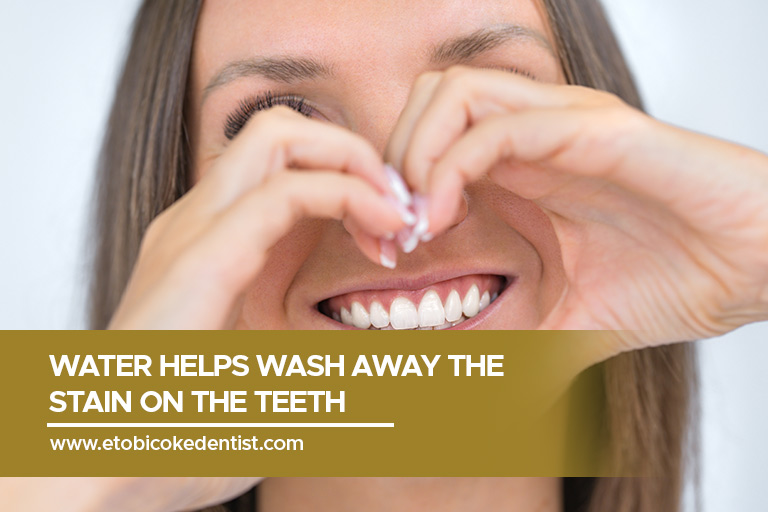Water helps wash away the stain on the teeth